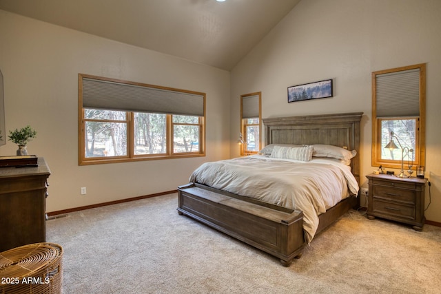 702 Flag Hollow Rd, Pinetop-Lakeside, AZ 85929 - bedroom with light carpet, baseboards, and high vaulted ceiling