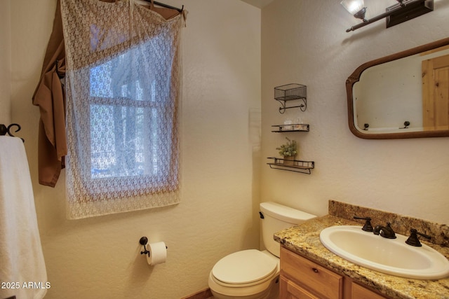 702 Flag Hollow Rd, Pinetop-Lakeside, AZ 85929 - bathroom featuring toilet and vanity