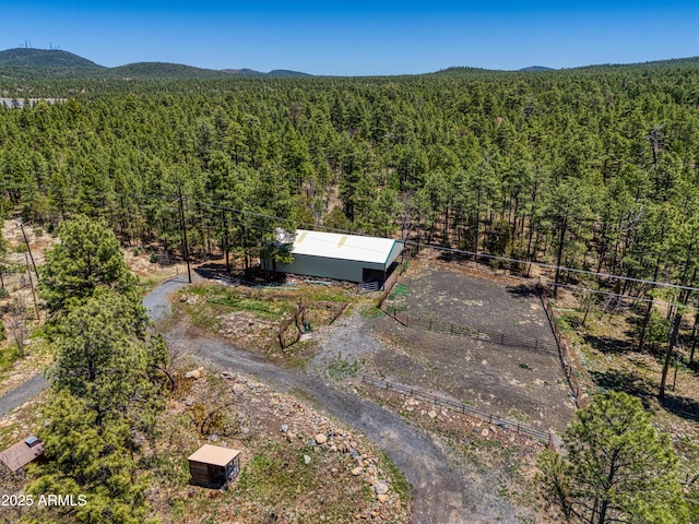 702 Flag Hollow Rd, Pinetop-Lakeside, AZ 85929 - view from above of property with a heavily wooded area and a mountainous background
