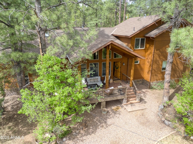 702 Flag Hollow Rd, Pinetop-Lakeside, AZ 85929 - back of property featuring roof with shingles, an outdoor hangout area, and a deck