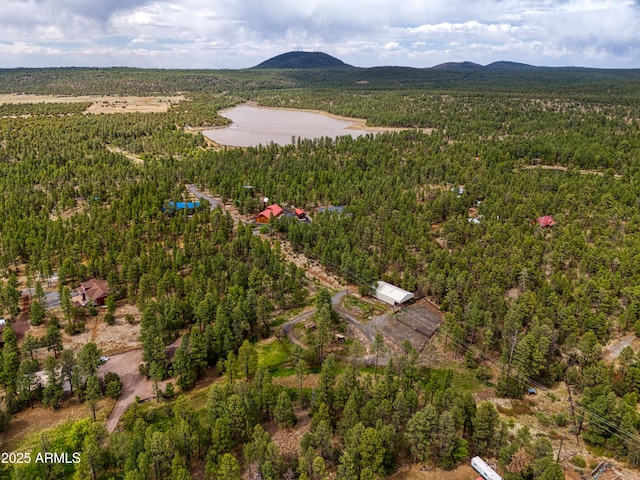 702 Flag Hollow Rd, Pinetop-Lakeside, AZ 85929 - aerial view of property and surrounding area with a heavily wooded area and mountains
