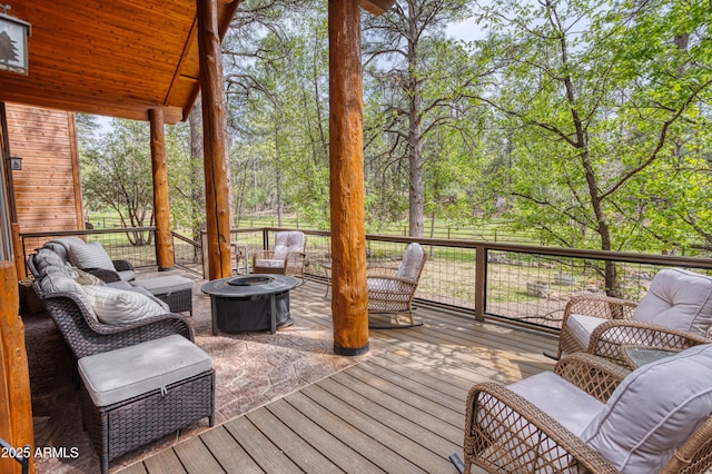 702 Flag Hollow Rd, Pinetop-Lakeside, AZ 85929 - deck featuring a fire pit and view of wooded area