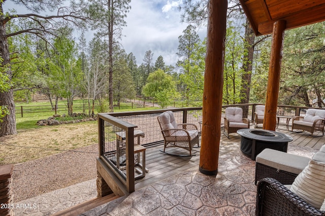 702 Flag Hollow Rd, Pinetop-Lakeside, AZ 85929 - view of patio featuring a wooden deck and an outdoor living space with a fire pit