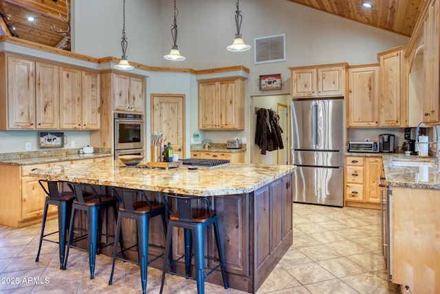 702 Flag Hollow Rd, Pinetop-Lakeside, AZ 85929 - kitchen featuring stainless steel appliances, high vaulted ceiling, light brown cabinetry, wood ceiling, and a kitchen island