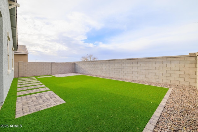 view of yard featuring a fenced backyard