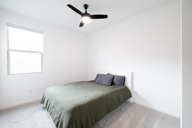 bedroom featuring ceiling fan, baseboards, and carpet flooring