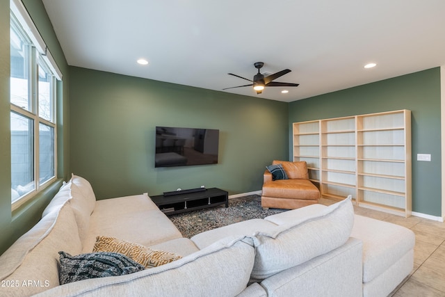 living room with a ceiling fan, recessed lighting, baseboards, and tile patterned floors