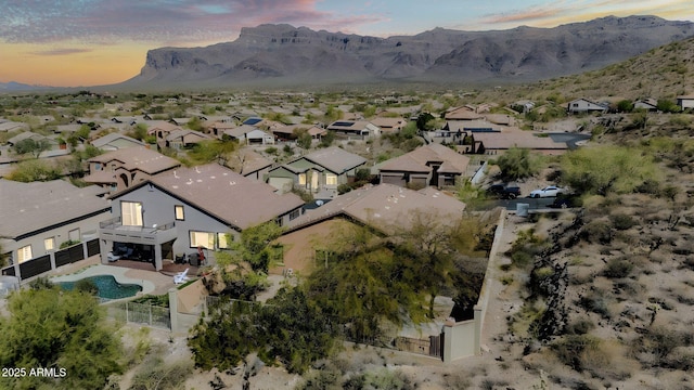 birds eye view of property with a residential view and a mountain view