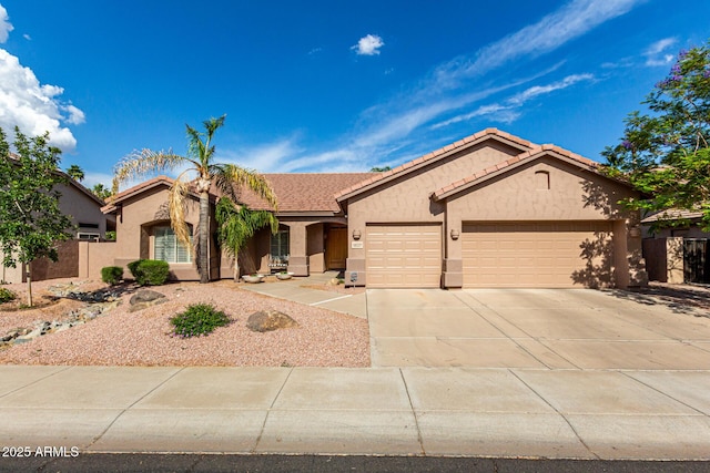 18021 N 53rd St, Scottsdale, AZ 85254 - ranch-style house with stucco siding, a garage, driveway, and a tiled roof