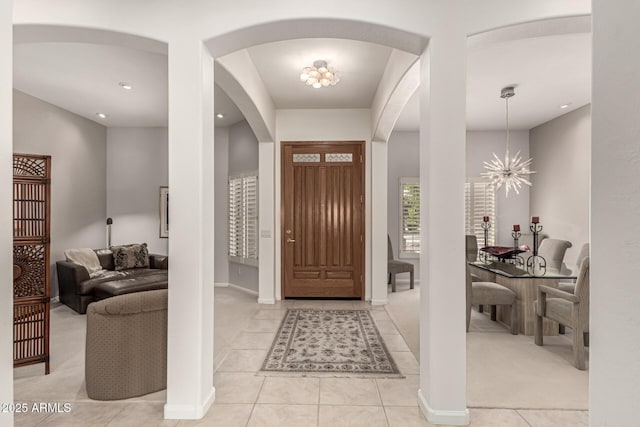 18021 N 53rd St, Scottsdale, AZ 85254 - entryway with arched walkways, a chandelier, light tile patterned floors, recessed lighting, and baseboards