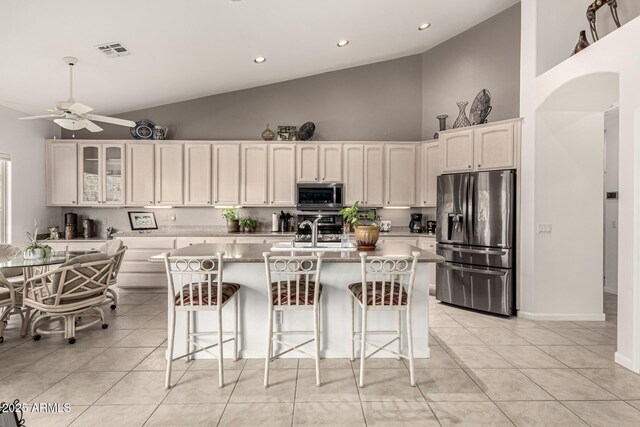 18021 N 53rd St, Scottsdale, AZ 85254 - kitchen with appliances with stainless steel finishes, high vaulted ceiling, a ceiling fan, a sink, and light tile patterned flooring