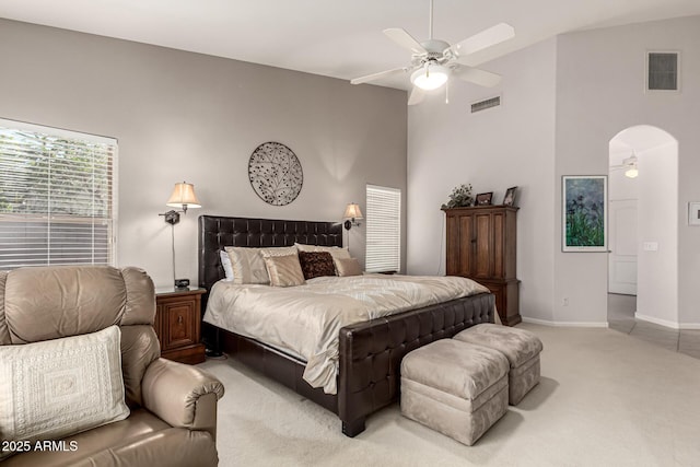 18021 N 53rd St, Scottsdale, AZ 85254 - bedroom with light colored carpet, high vaulted ceiling, baseboards, a ceiling fan, and arched walkways