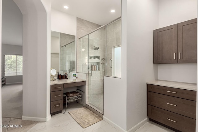 18021 N 53rd St, Scottsdale, AZ 85254 - full bath with baseboards, a shower stall, marble finish flooring, vanity, and recessed lighting
