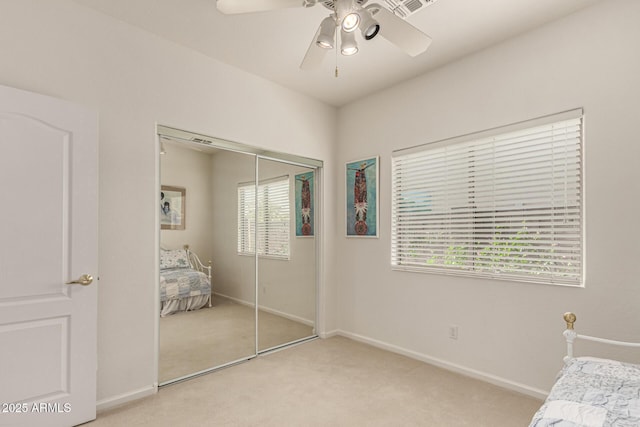 18021 N 53rd St, Scottsdale, AZ 85254 - unfurnished bedroom featuring light colored carpet, a closet, baseboards, and a ceiling fan