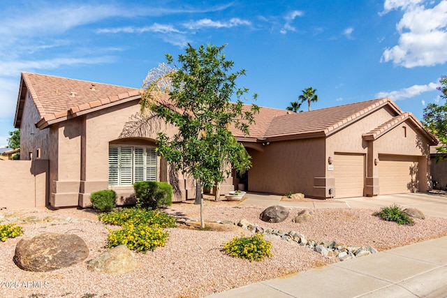 18021 N 53rd St, Scottsdale, AZ 85254 - ranch-style house with an attached garage, stucco siding, driveway, and a tiled roof