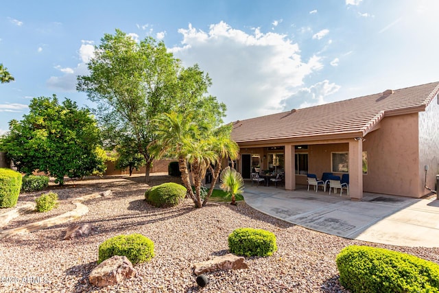 18021 N 53rd St, Scottsdale, AZ 85254 - rear view of property with a tiled roof, stucco siding, and a patio