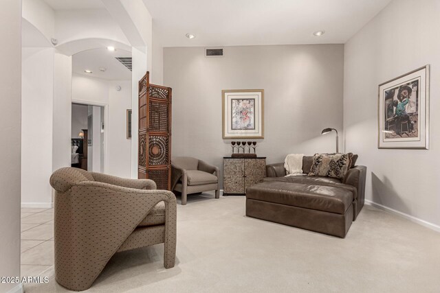 18021 N 53rd St, Scottsdale, AZ 85254 - living area with arched walkways, light carpet, recessed lighting, and baseboards