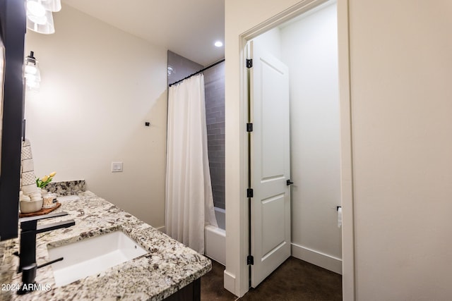 bathroom featuring shower / tub combo, vanity, and concrete flooring