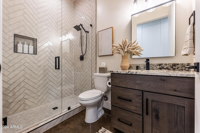 bathroom featuring vanity, toilet, and a shower with shower door