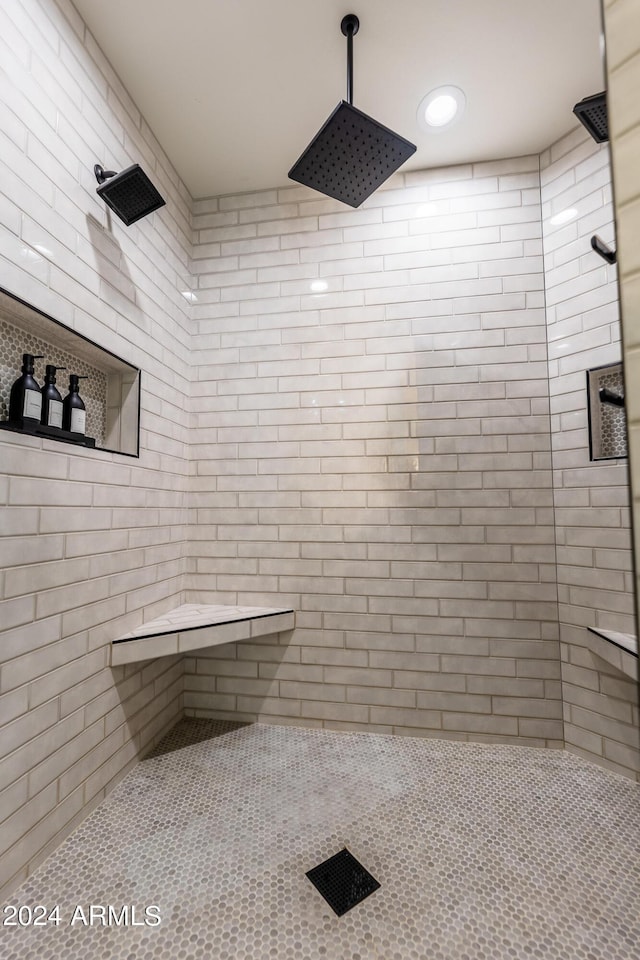 bathroom with tiled shower