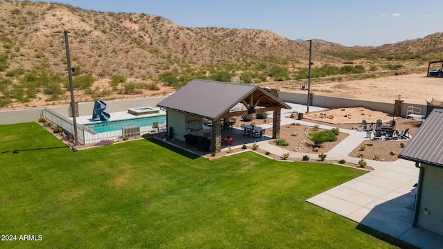 birds eye view of property featuring a mountain view