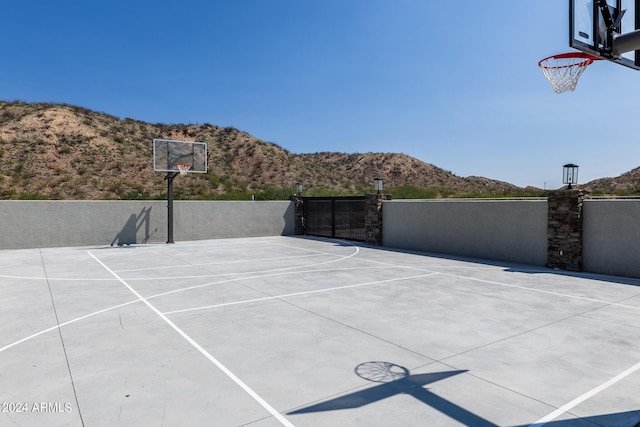 view of basketball court featuring a mountain view