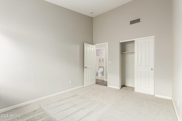 3152 N 83rd Pl, Scottsdale, AZ 85251 - unfurnished bedroom with carpet flooring, a closet, and a high ceiling