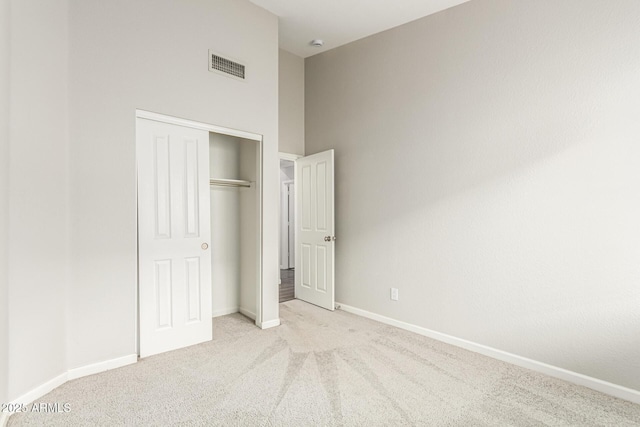 3152 N 83rd Pl, Scottsdale, AZ 85251 - unfurnished bedroom featuring carpet floors, a closet, and a towering ceiling