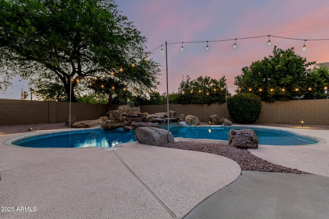 3152 N 83rd Pl, Scottsdale, AZ 85251 - pool at dusk featuring a fenced backyard and a patio area