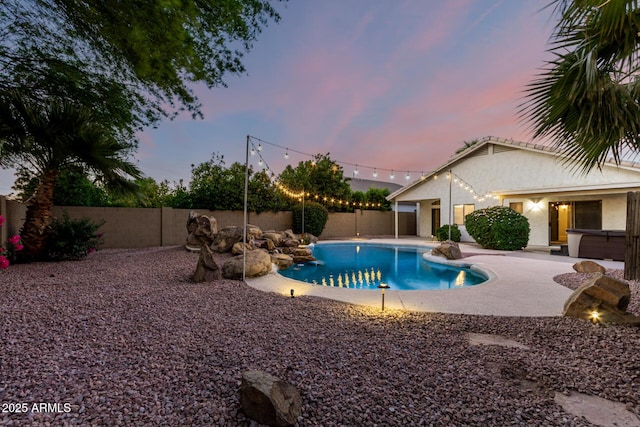 3152 N 83rd Pl, Scottsdale, AZ 85251 - pool at dusk with a fenced backyard and a patio