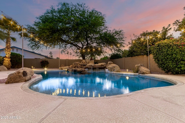 3152 N 83rd Pl, Scottsdale, AZ 85251 - pool at dusk with a fenced backyard and a patio
