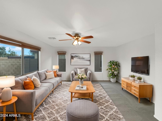 carpeted living room featuring ceiling fan