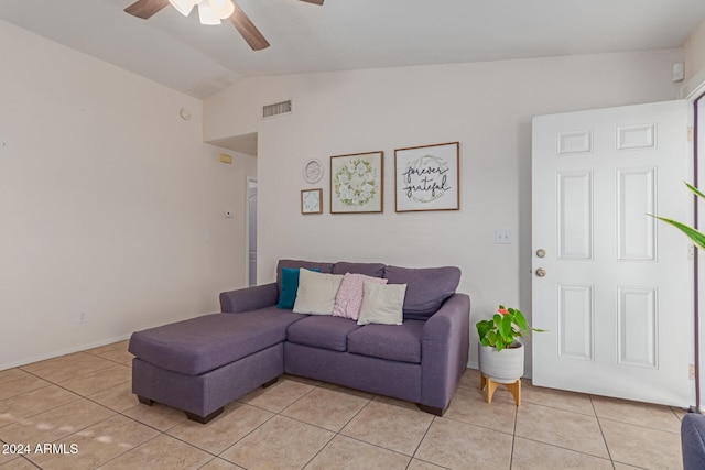 tiled living room featuring ceiling fan and vaulted ceiling