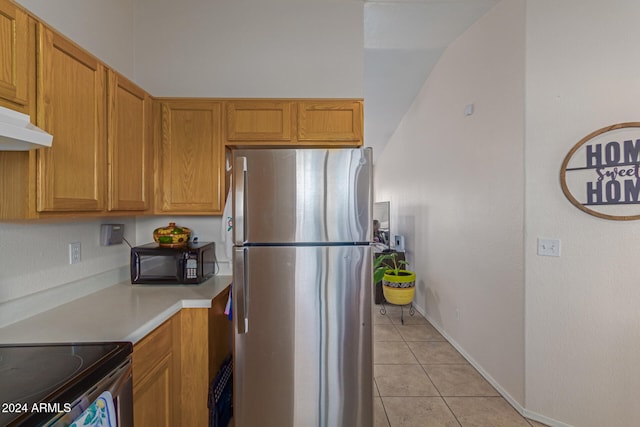 kitchen featuring appliances with stainless steel finishes and light tile patterned floors