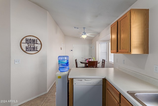 kitchen with ceiling fan, light tile patterned floors, and dishwasher