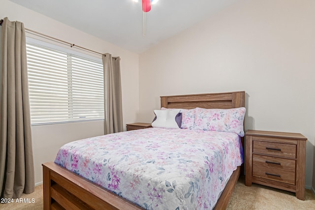 carpeted bedroom featuring lofted ceiling