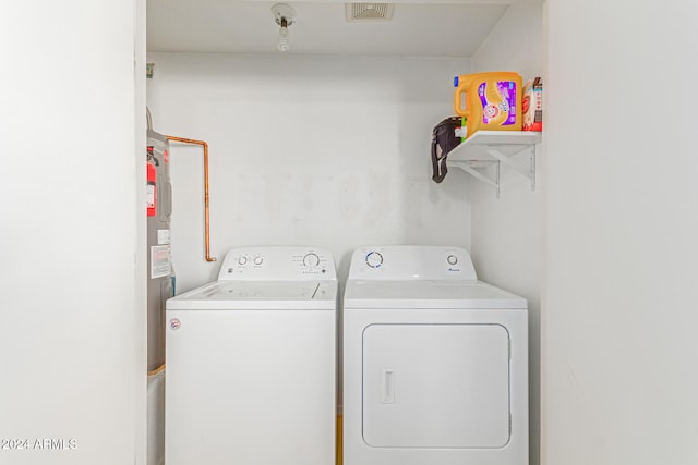 washroom featuring washing machine and dryer