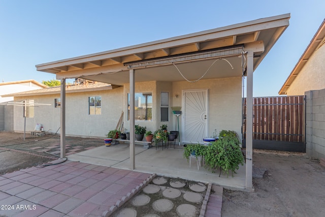 rear view of property with a patio area