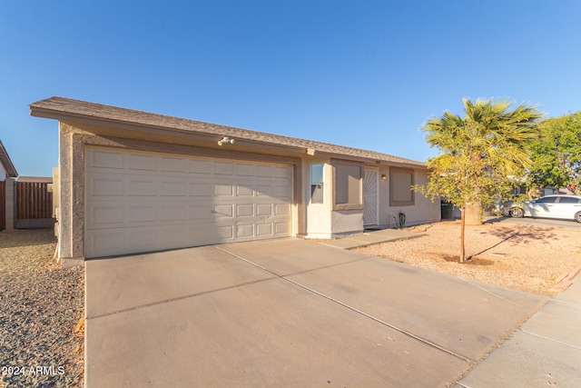 ranch-style house featuring a garage