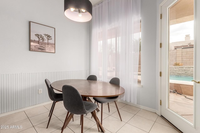 dining space with light tile patterned floors