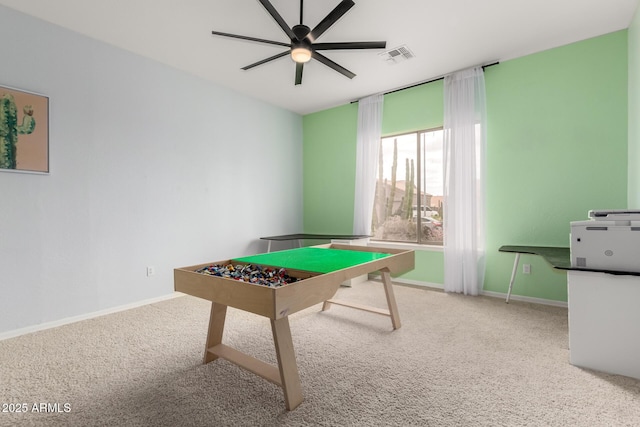 recreation room featuring carpet flooring, baseboards, and a ceiling fan
