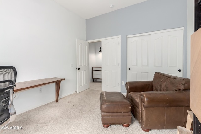 living area with carpet and baseboards