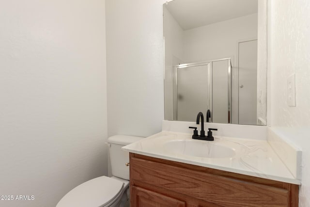 full bath featuring vanity, toilet, and a shower stall