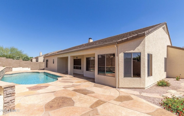 view of pool featuring a fenced backyard and a patio
