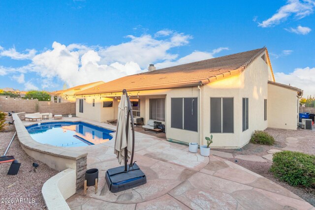 view of swimming pool featuring a fenced backyard and a patio area
