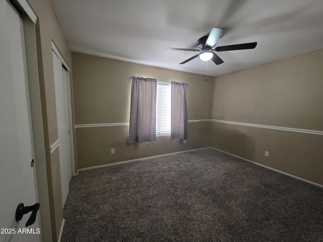 unfurnished bedroom featuring a closet, baseboards, a ceiling fan, and carpet