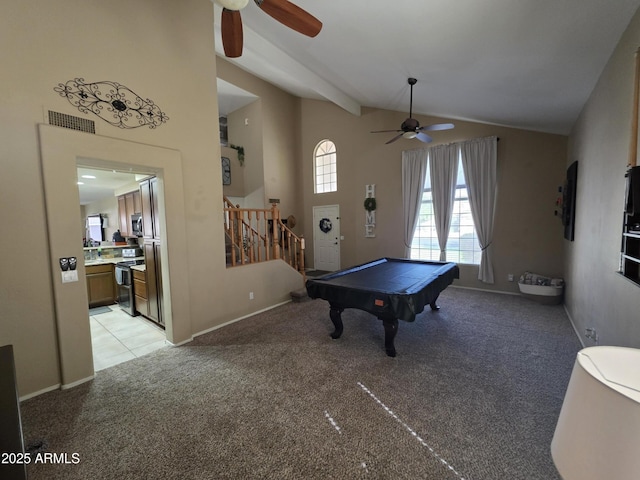 recreation room with visible vents, a ceiling fan, light colored carpet, and lofted ceiling