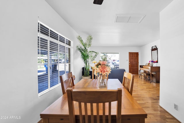 dining area featuring a healthy amount of sunlight and wood-type flooring