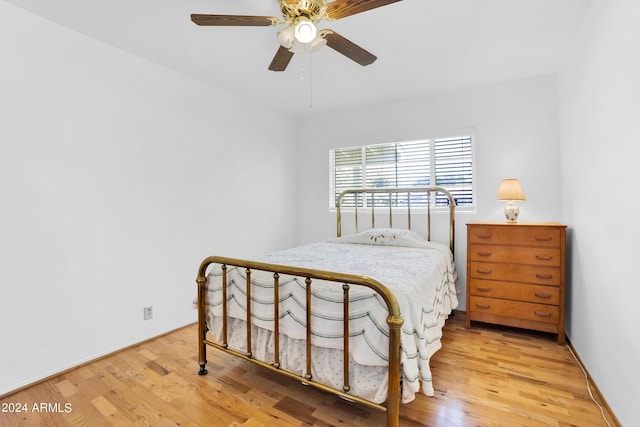 bedroom with wood-type flooring and ceiling fan