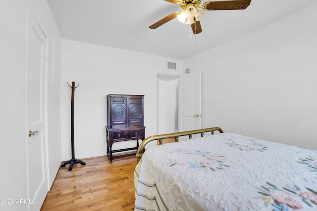 bedroom with wood-type flooring and ceiling fan